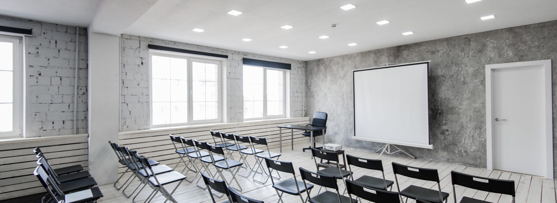 Empty loft classroom with chairs and desks